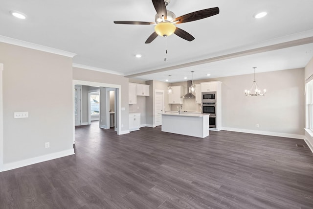 unfurnished living room featuring crown molding, sink, dark hardwood / wood-style floors, and ceiling fan with notable chandelier