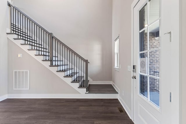 foyer entrance featuring dark hardwood / wood-style flooring