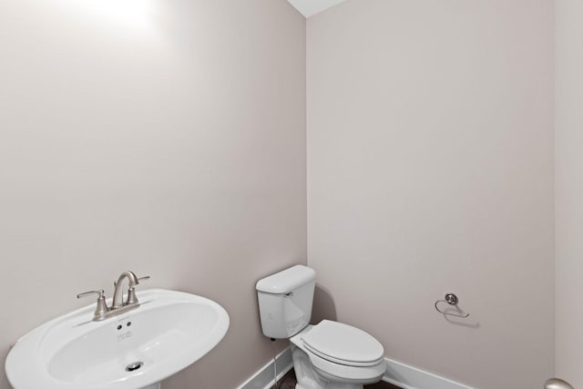 bathroom with toilet and sink