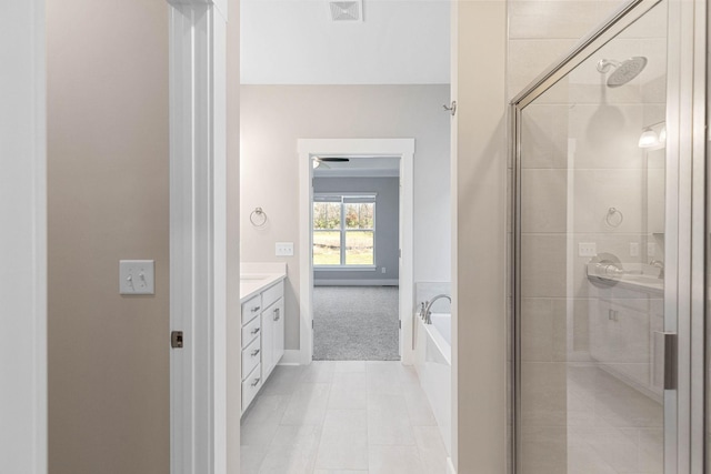 bathroom with vanity, separate shower and tub, and tile patterned flooring