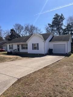 view of front of home featuring a garage and driveway