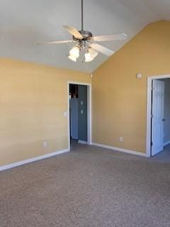 spare room featuring carpet, vaulted ceiling, baseboards, and ceiling fan