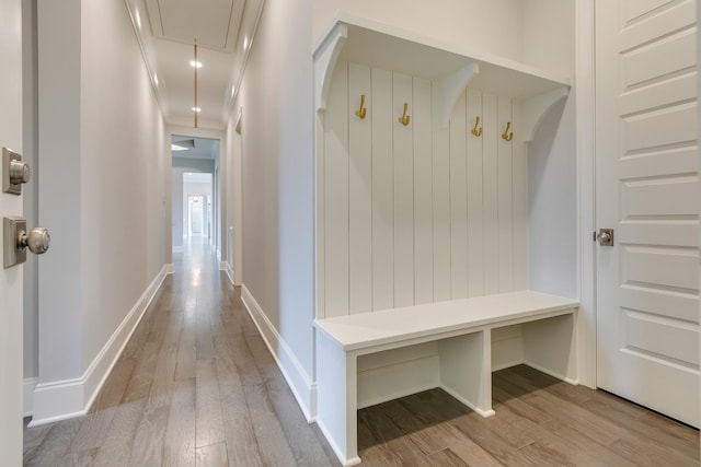 mudroom featuring light hardwood / wood-style flooring and ornamental molding