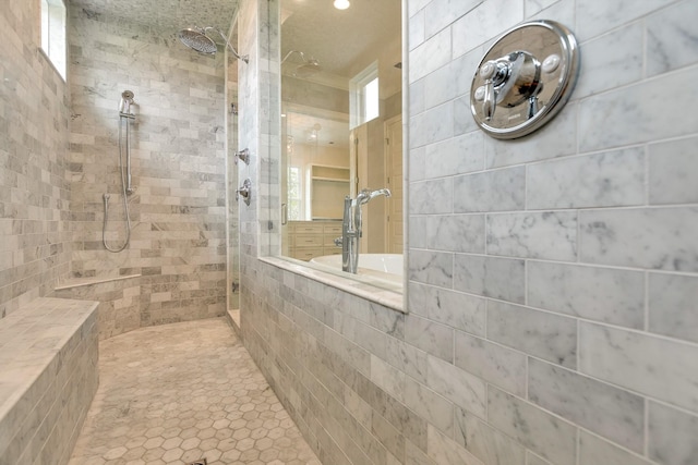 bathroom with a tile shower