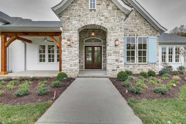 entrance to property featuring ceiling fan and french doors