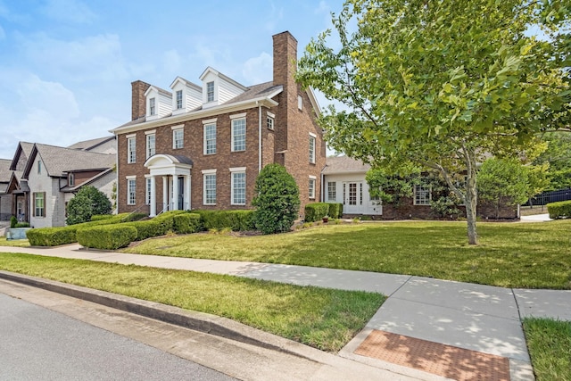 colonial home with a front yard