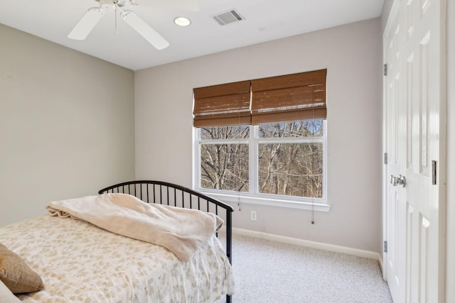 bedroom with ceiling fan, carpet flooring, and a closet