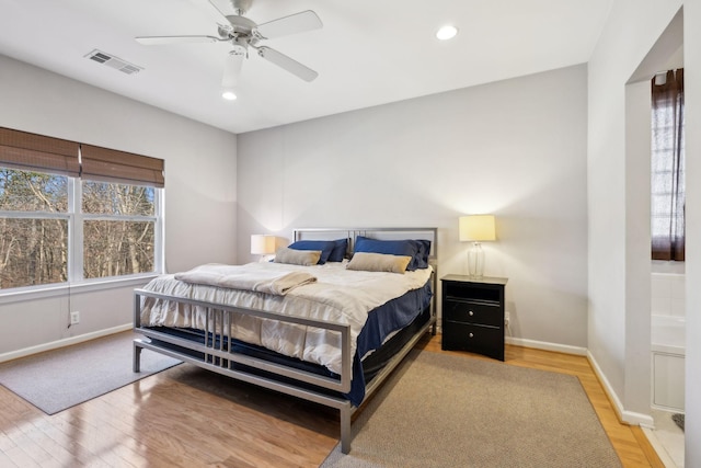 bedroom featuring ceiling fan and light wood-type flooring