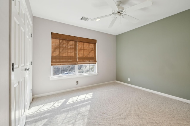 carpeted empty room with ceiling fan