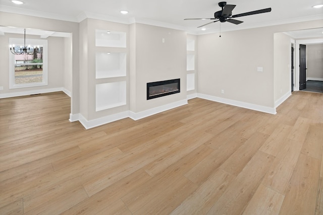 unfurnished living room with crown molding and light hardwood / wood-style floors