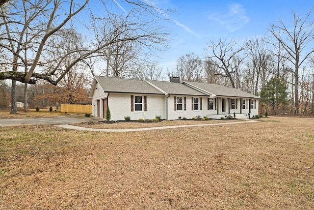 view of front of property with a garage and a front yard