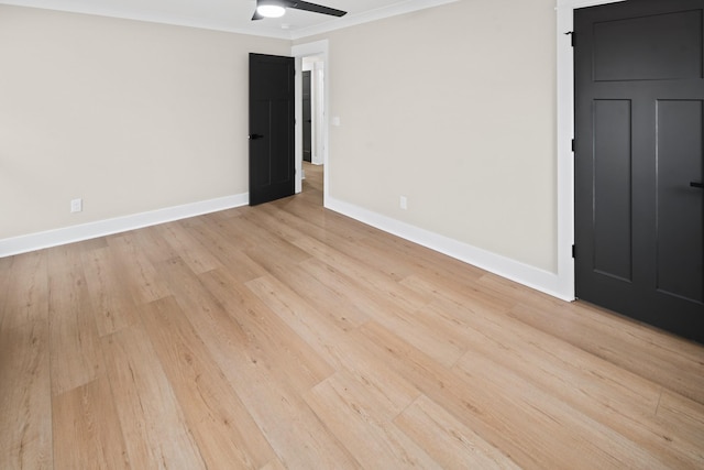 unfurnished room featuring light hardwood / wood-style flooring, ornamental molding, and ceiling fan