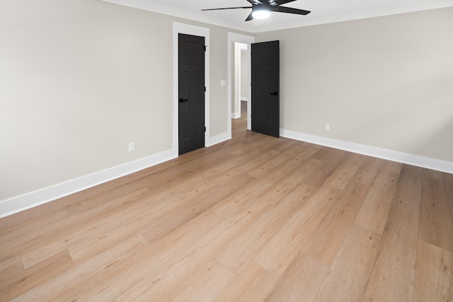 unfurnished room featuring crown molding, ceiling fan, and light wood-type flooring