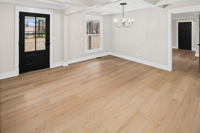 unfurnished dining area featuring beamed ceiling, a notable chandelier, coffered ceiling, and light wood-type flooring