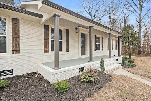 view of side of property featuring a porch