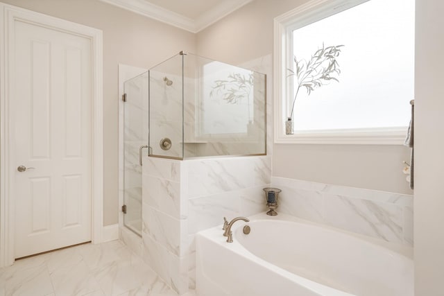 bathroom featuring ornamental molding and shower with separate bathtub