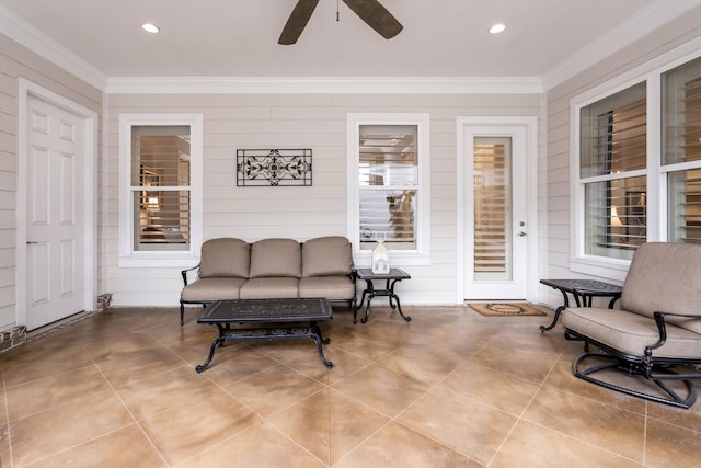 interior space featuring outdoor lounge area and ceiling fan