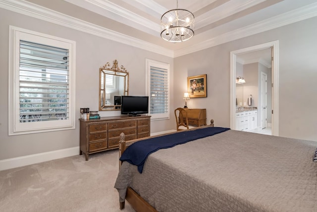 bedroom with connected bathroom, a raised ceiling, crown molding, light carpet, and an inviting chandelier