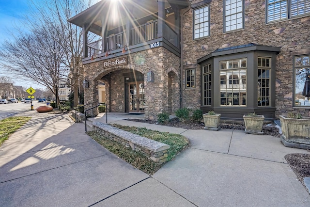 entrance to property with a balcony