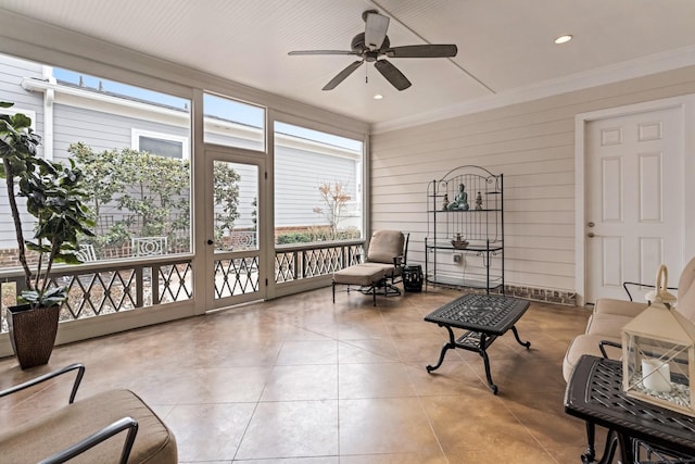 sunroom featuring ceiling fan