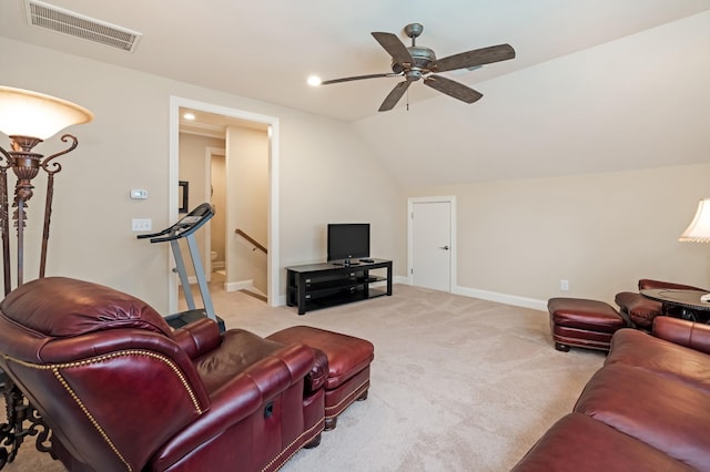 living room featuring vaulted ceiling, light carpet, and ceiling fan