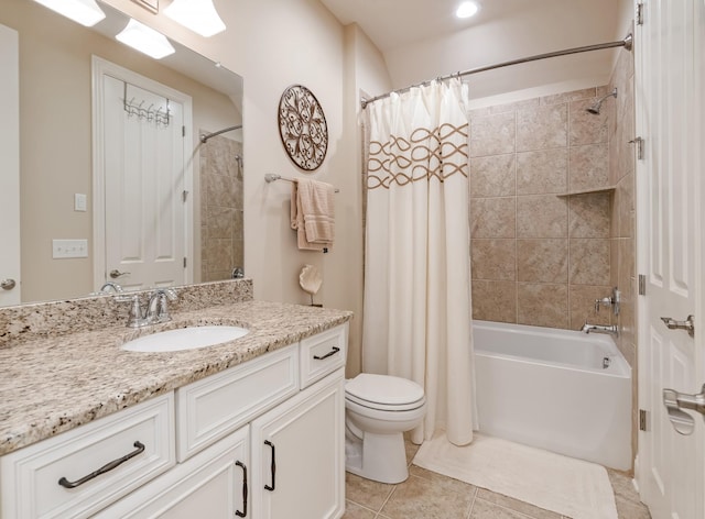 full bathroom featuring vanity, shower / tub combo, tile patterned floors, and toilet