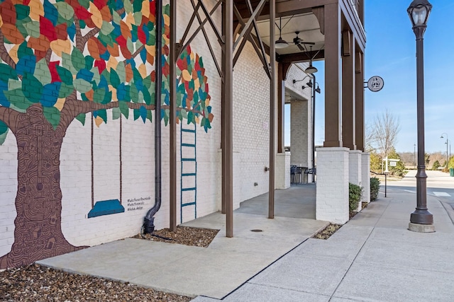 entrance to property featuring ceiling fan