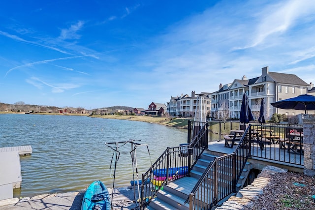 dock area featuring a deck with water view