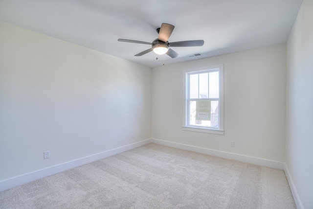 carpeted empty room with ceiling fan