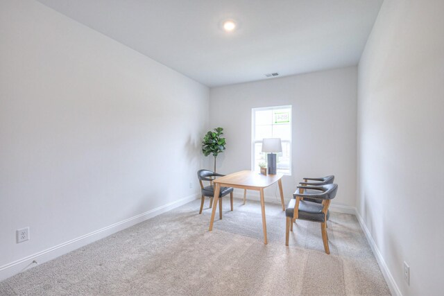 home office featuring baseboards, visible vents, and carpet floors