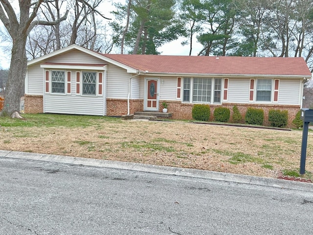 ranch-style house with a front lawn