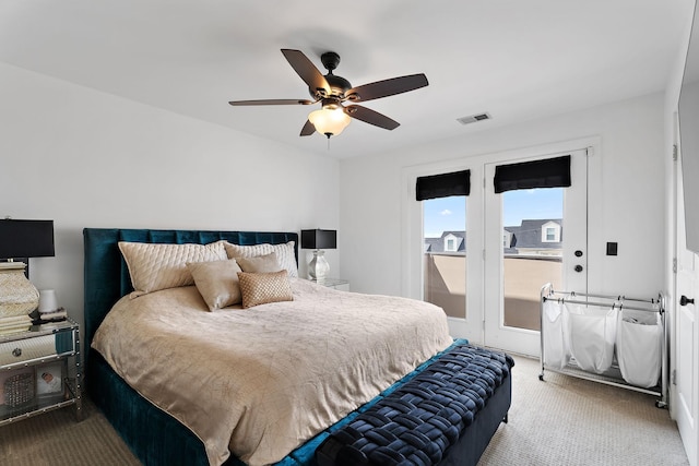 carpeted bedroom with ceiling fan and access to exterior