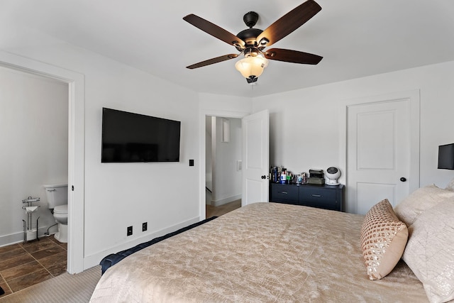 bedroom with ensuite bathroom and ceiling fan