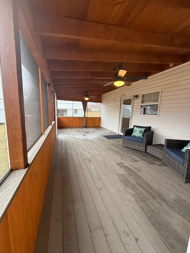 wooden terrace featuring ceiling fan