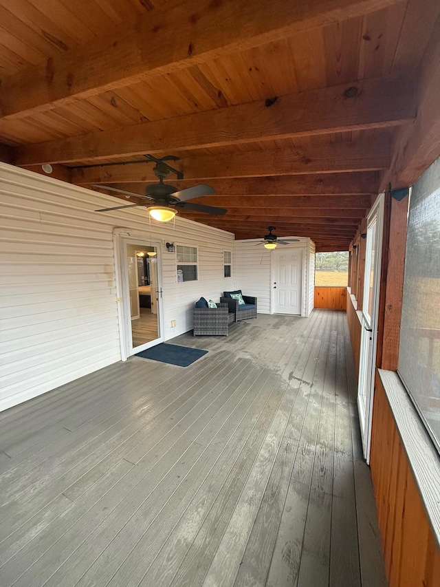 wooden terrace featuring an outdoor hangout area and ceiling fan