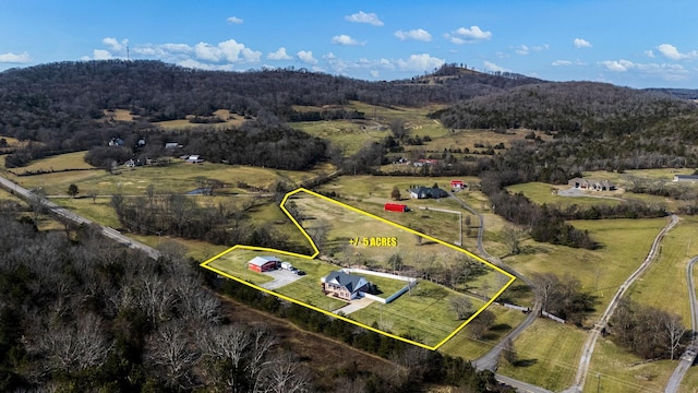 aerial view with a view of trees and a rural view