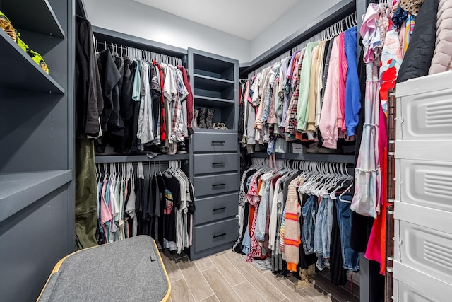 spacious closet featuring wood tiled floor