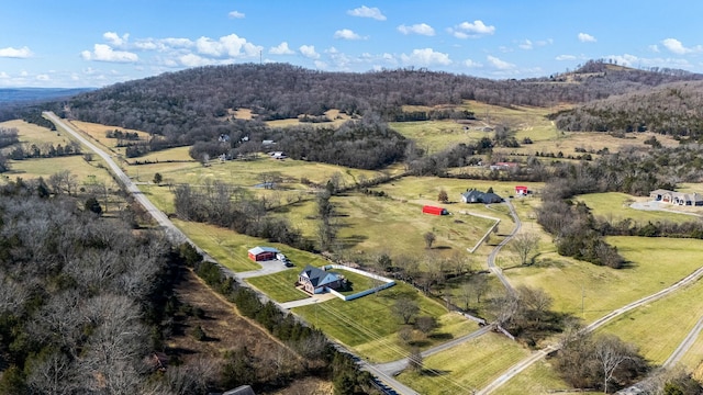 birds eye view of property with a rural view