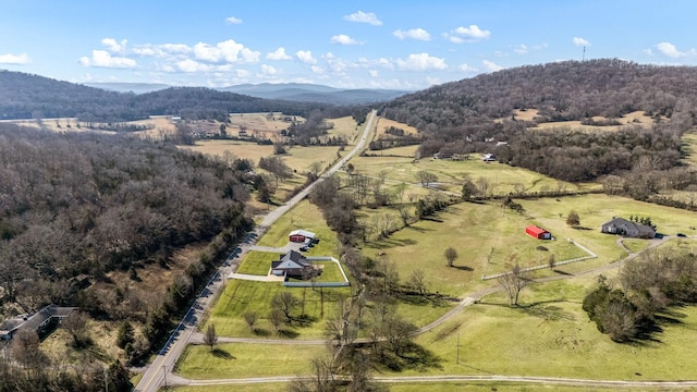 bird's eye view featuring a forest view, a rural view, and a mountain view