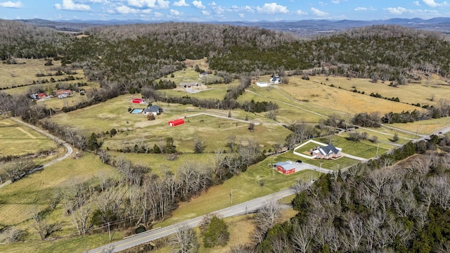 aerial view with a rural view, a mountain view, and a view of trees