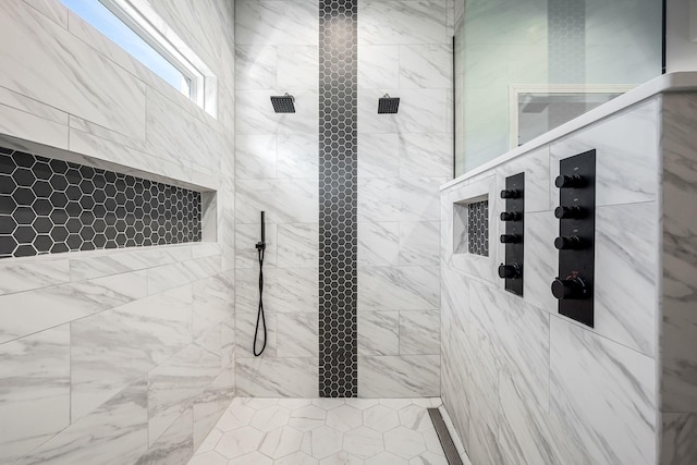 bathroom with tiled shower