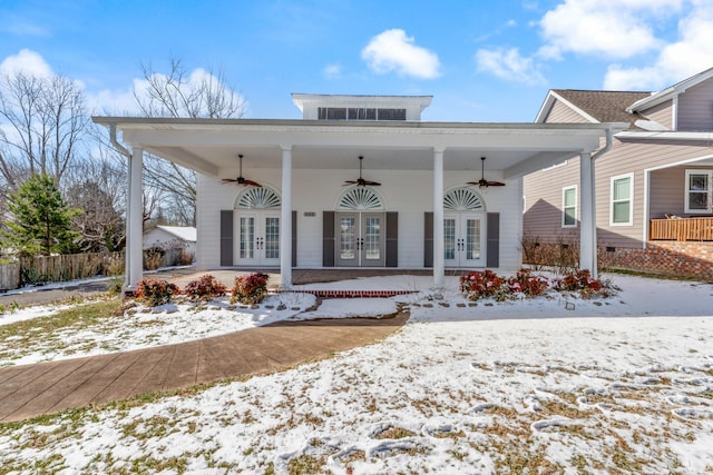 exterior space with a ceiling fan and french doors