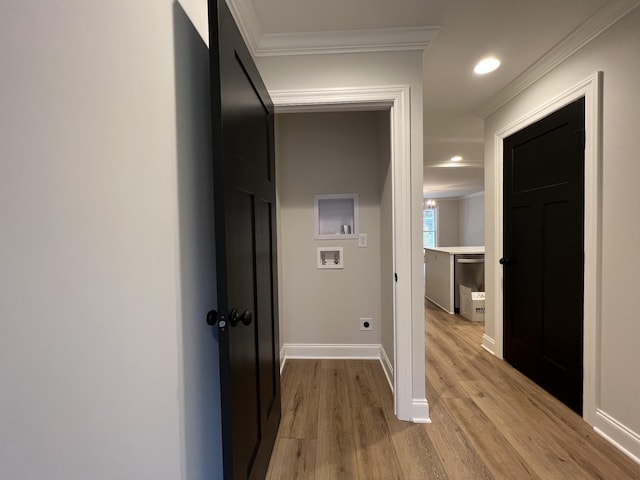 hallway featuring ornamental molding and light hardwood / wood-style floors