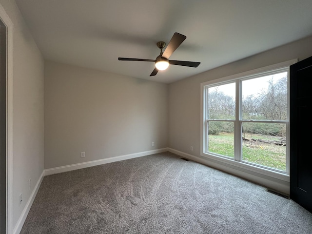 carpeted empty room with ceiling fan