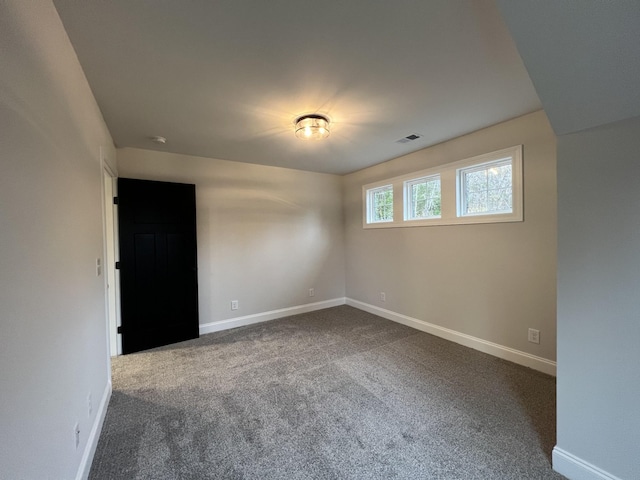 unfurnished room featuring carpet