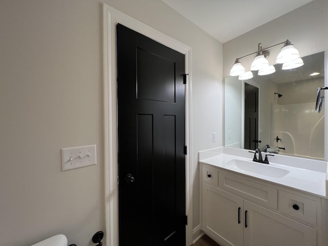 bathroom with a shower and vanity