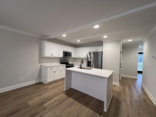 kitchen with crown molding, appliances with stainless steel finishes, sink, and white cabinets