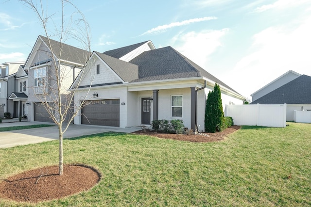 view of front of house with driveway, a garage, a shingled roof, fence, and a front lawn