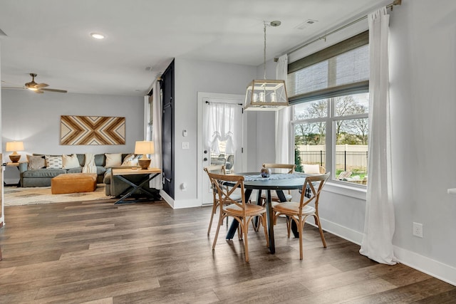 dining area featuring dark hardwood / wood-style floors and ceiling fan