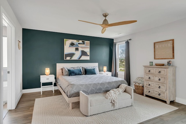 bedroom featuring hardwood / wood-style flooring and ceiling fan